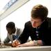Michigan freshman Spike Albrecht signs autographs for fans before the basketball banquet on Tuesday, April 16. AnnArbor.com I Daniel Brenner